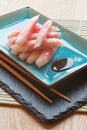 Fresh raw sushi crabsticks on plate with chopsticks Royalty Free Stock Photo