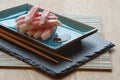 Fresh raw sushi crabsticks on plate with chopsticks Royalty Free Stock Photo