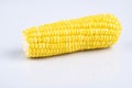 Fresh raw sweet corn on the cob kernels over white background Royalty Free Stock Photo