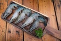 Fresh raw Tiger Prawn on wooden plate