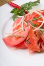 Fresh raw tomato salad served with onion Royalty Free Stock Photo