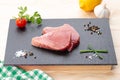 Fresh raw tuna steaks with seasoning Royalty Free Stock Photo