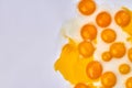 Fresh raw uncooked yolks on white background.
