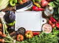 Fresh raw vegetable ingredients for healthy cooking or salad making with white ceramic board in center, top view, copy Royalty Free Stock Photo