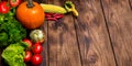 Fresh raw vegetables on wooden background copy space