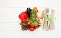 Fresh  raw vegetables in wooden plate  , fork and knife on white wooden board. Healthy eating and dieting concept Royalty Free Stock Photo