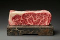 Fresh, raw wagyu beef steak resting on a marble cutting board, ready for preparation Royalty Free Stock Photo