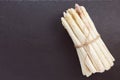 Fresh raw white asparagus spears on black background, closeup, copy space Royalty Free Stock Photo