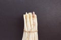 Fresh raw white asparagus spears on black background, copy space Royalty Free Stock Photo