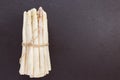 Fresh raw white asparagus spears on black background, copy space Royalty Free Stock Photo