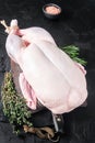 Fresh Raw whole duck with herbs and spices. Black background. Top view Royalty Free Stock Photo