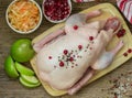 Fresh raw whole duck ready for cooking with apples, cranberries and cabbage Royalty Free Stock Photo