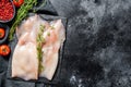 Fresh raw whole squid. Black background. Top view. Copy space Royalty Free Stock Photo