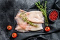 Fresh raw whole squid. Black background. Top view Royalty Free Stock Photo