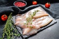 Fresh raw whole squid. Black background. Top view Royalty Free Stock Photo