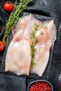 Fresh raw whole squid. Black background. Top view Royalty Free Stock Photo