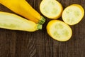 Fresh Raw yellow zucchini on brown wood Royalty Free Stock Photo