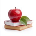 Fresh Red Apple with Green Leaf on Stacked Books Isolated Royalty Free Stock Photo