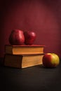 Fresh Red Apples and Old Books Royalty Free Stock Photo