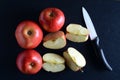 Fresh, red apples over dark background