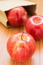 Fresh red apples with paper bag Royalty Free Stock Photo