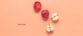 Fresh red apples on a pastel pink background, banner. Creative layout. Top view