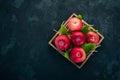 Fresh red apples in a wooden box. Organic food. On a white wooden background. Royalty Free Stock Photo