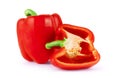 Fresh red bell pepper capsicum and a cut one on a white backgr Royalty Free Stock Photo