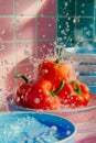 Fresh Red Bell Pepper Splashing in Water with Vibrant Pink Tile Background in Bright Sunlight Royalty Free Stock Photo