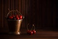 Fresh red cherries in copper bucket on dark wooden background Royalty Free Stock Photo