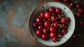 Fresh red cherries fruit on plate on wooden background close up. Royalty Free Stock Photo
