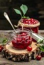 Fresh red cherries fruit on wooden background. Jar of cherry jam and sour cherries. Berries cherry with syrup. Canned fruit. Royalty Free Stock Photo