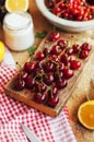 Fresh red cherries on a rustic wooden table. Ripe cherries i o Royalty Free Stock Photo