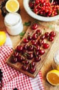 Fresh red cherries on a rustic wooden table. Ripe cherries i o Royalty Free Stock Photo