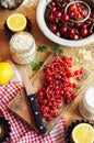 Fresh red cherries on a rustic wooden table. Ripe cherries i o Royalty Free Stock Photo