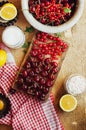 Fresh red cherries on a rustic wooden table. Ripe cherries i o Royalty Free Stock Photo