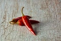 Fresh red chili peppers on an old vintage wooden table