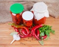 Fresh red chili among spices, pickled chili and other vegetables Royalty Free Stock Photo