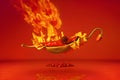 Fresh red chilli pepper in fire as a symbol of burning feeling of spicy food and spices. Red background. Neural network