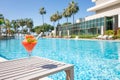 Fresh red cocktail with ice in glass on swimming pool. Tropical juice on luxury vacations. Concept summer holiday and Royalty Free Stock Photo