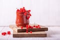 Fresh red currant in a ceramic cup on a white wooden background Royalty Free Stock Photo