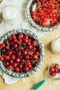 Fresh red currant on wooden table, bucket with red currant berri Royalty Free Stock Photo