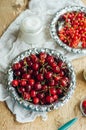 Fresh red currant on wooden table, bucket with red currant berri Royalty Free Stock Photo