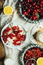 Fresh red currant on wooden table, bucket with red currant berri Royalty Free Stock Photo