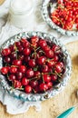 Fresh red currant on wooden table, bucket with red currant berri Royalty Free Stock Photo