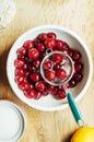 Fresh red currant on wooden table, bucket with red currant berri Royalty Free Stock Photo