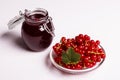 Fresh red currants and jam on a white background Royalty Free Stock Photo