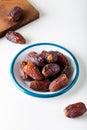 Fresh red dates hurma in a bowl Royalty Free Stock Photo