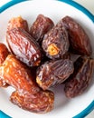 Fresh red dates hurma in a bowl Royalty Free Stock Photo