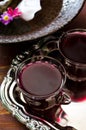 Fresh red grape juice and flowers Royalty Free Stock Photo